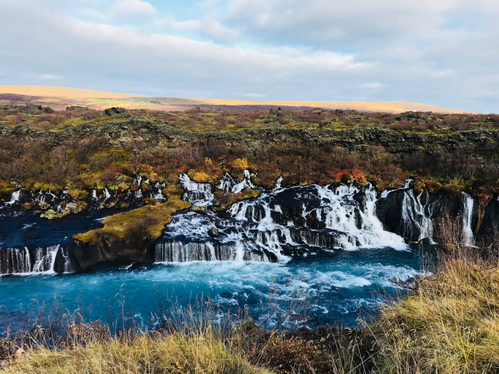 Hraunfossar is a hidden gem in Iceland and a beautiful pit stop on your road trip through Iceland
