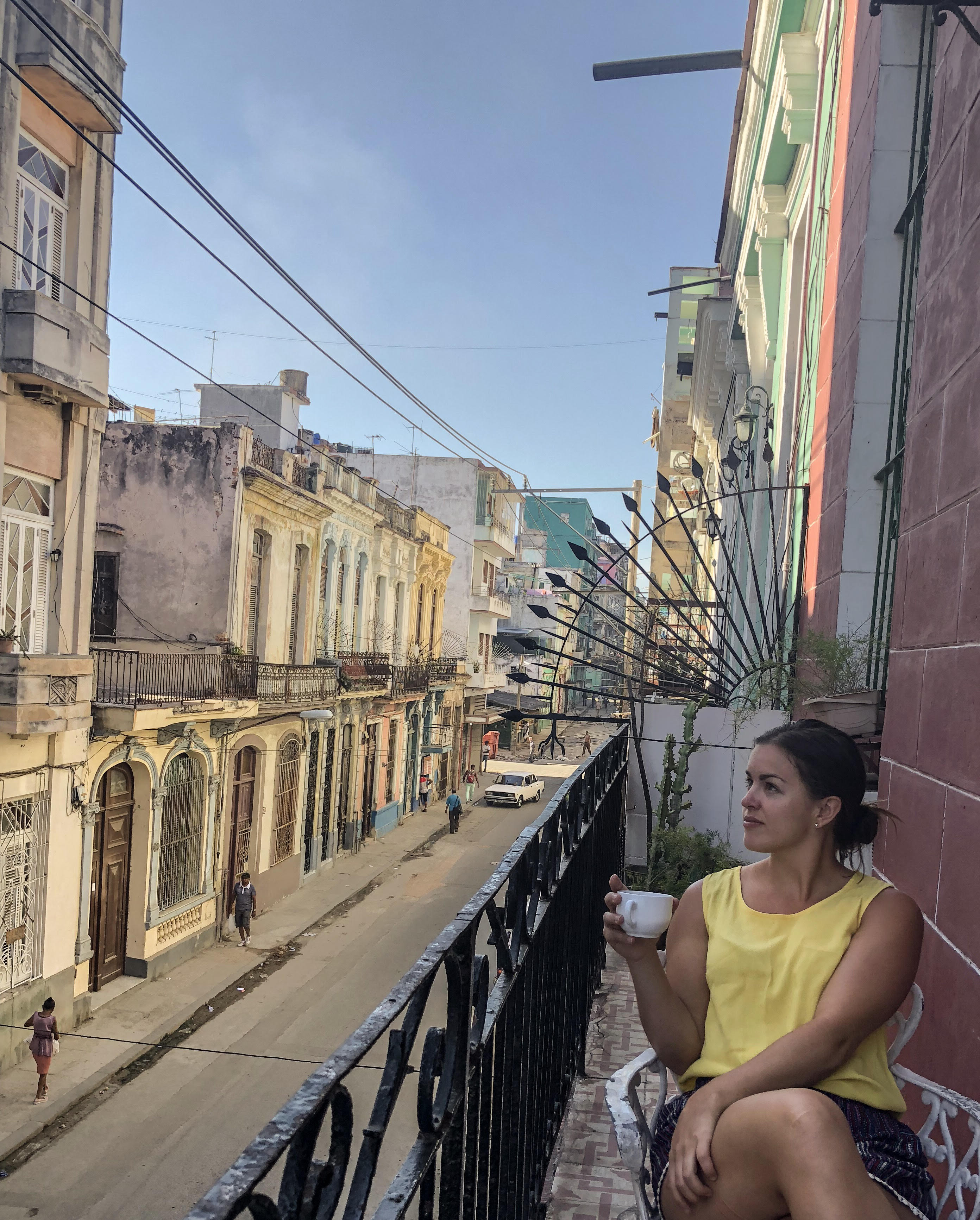 Havana Cuba balcony overlooking the colored houses. This is a perfect 6 day itinerary to Cuba.
