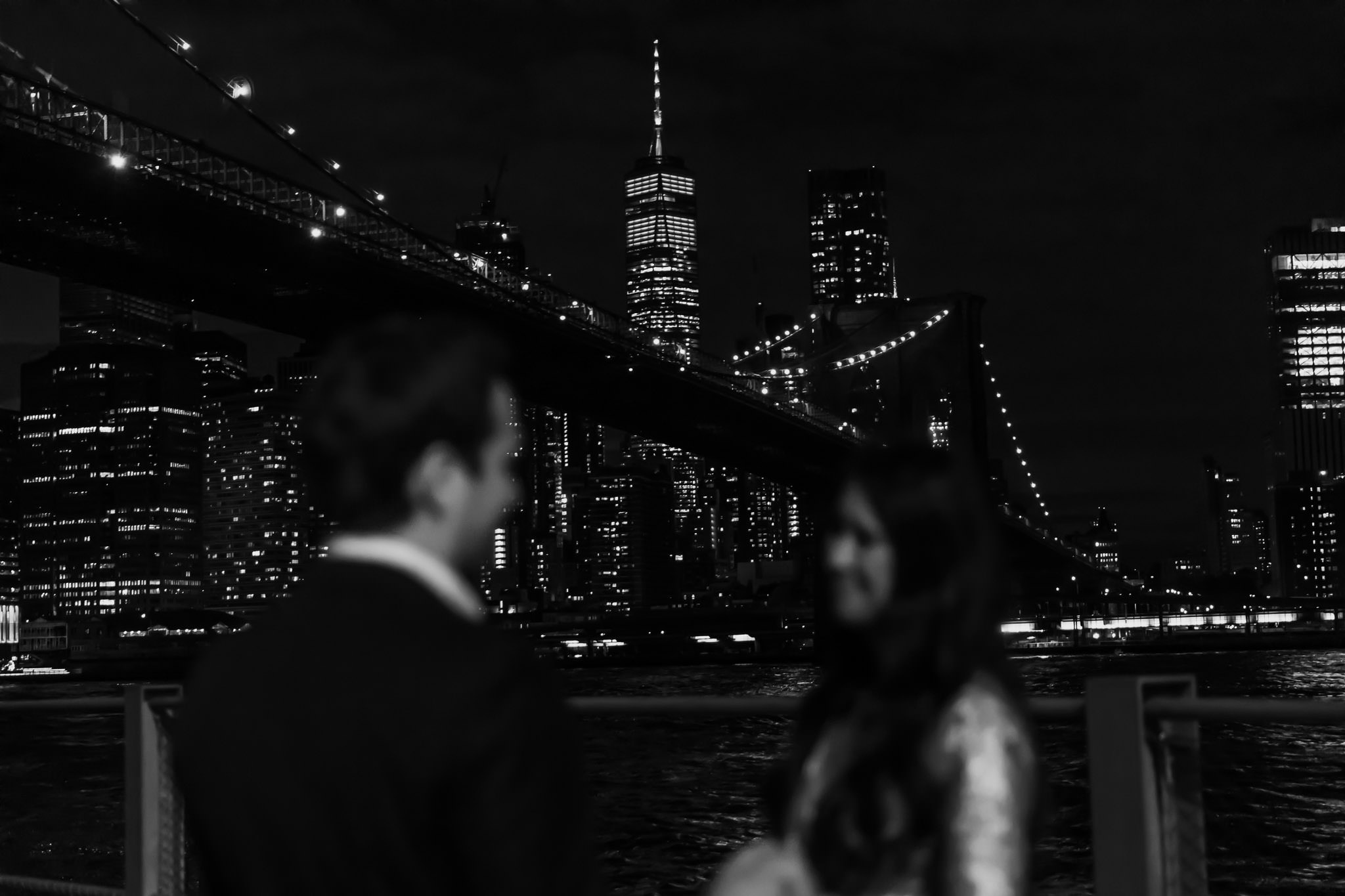 New York City romantic proposal at Brooklyn Bridge at night