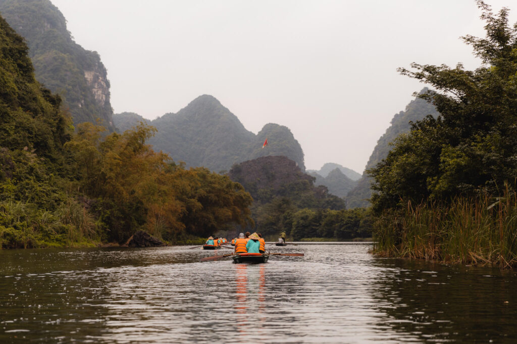 Trang An boat tour in Ninh Binh Vietnam is a top thing to do when visiting