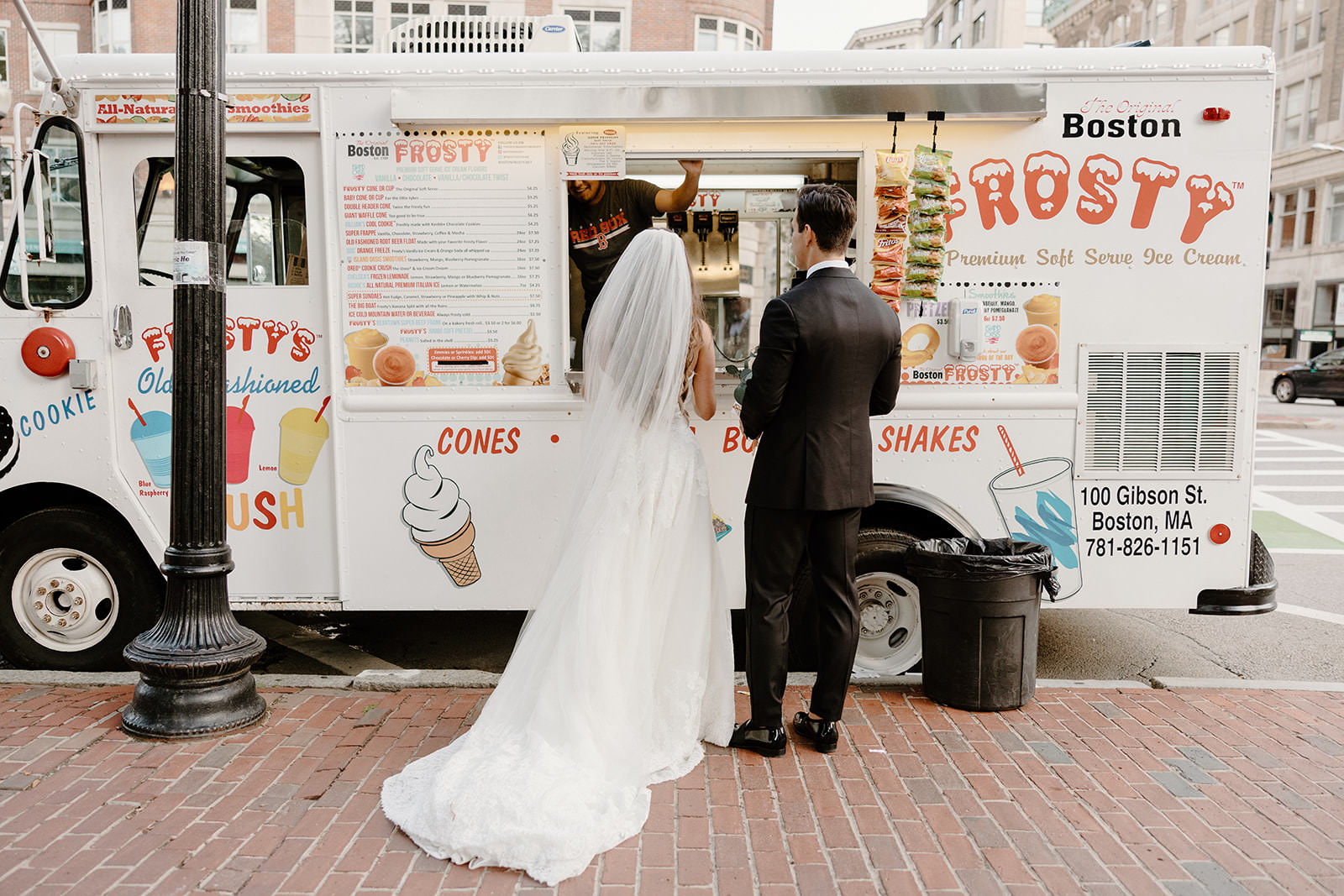 Bride and groom eating ice cream at their elopement.