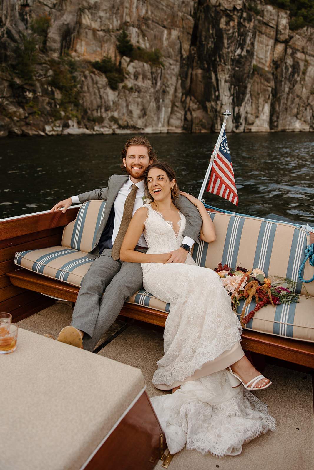 Adventure elopement with bride and groom enjoying boat ride