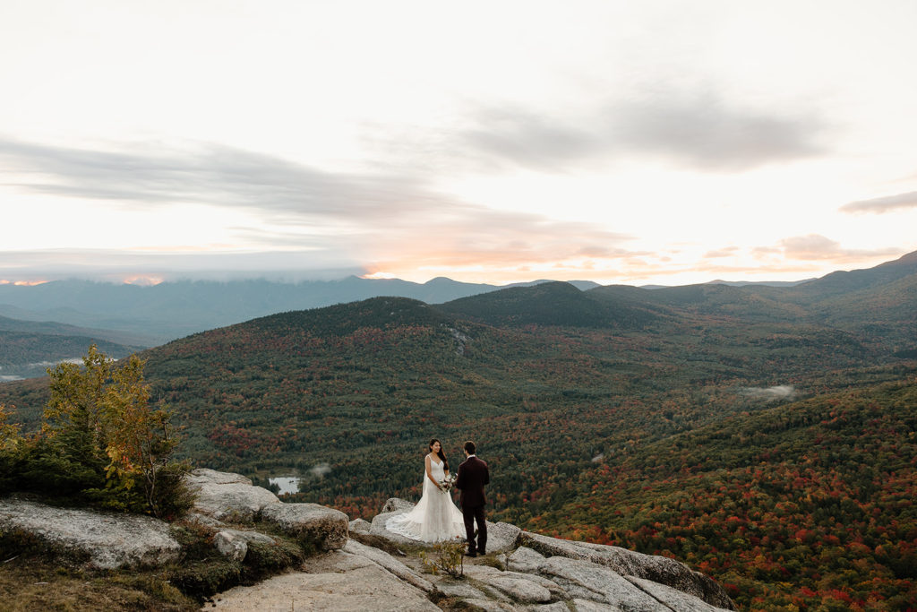 Crawford Notch Elopement ceremony location in mountains. Bride and groom saying I do.