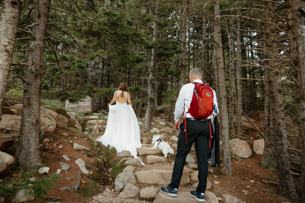 Bride and groom hiking at elopement