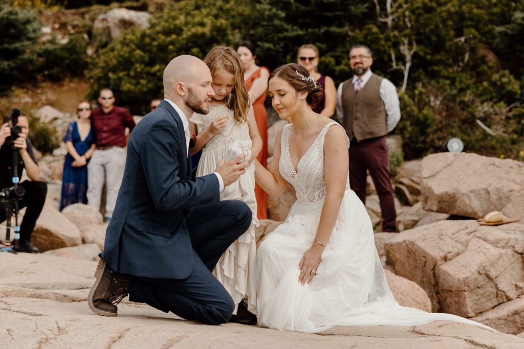 Elopement ceremony with bride, groom, and their daughter