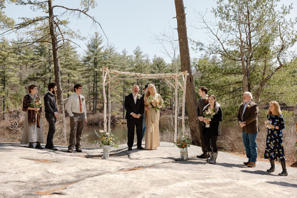 Elopement ceremony in the woods with family