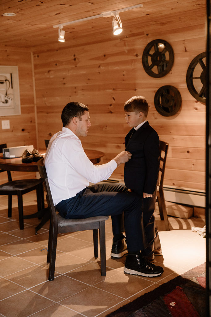 Groom and his son getting dressed for elopement.