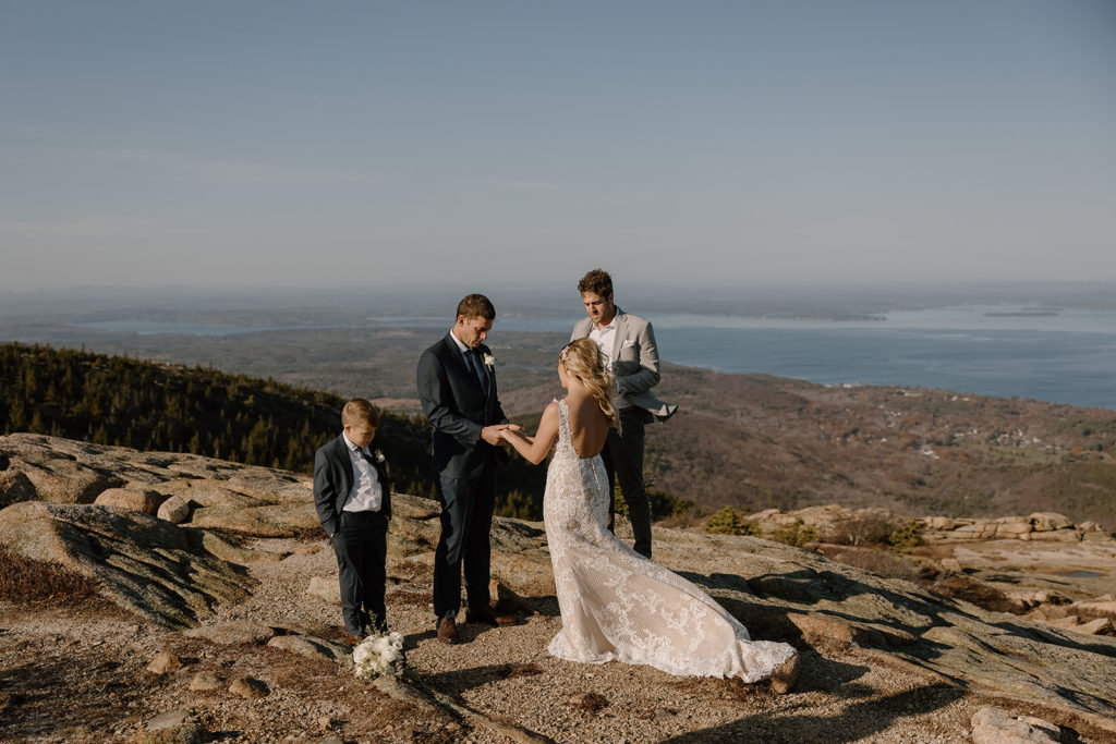 Elopement ceremony with a kid in Acadia. 