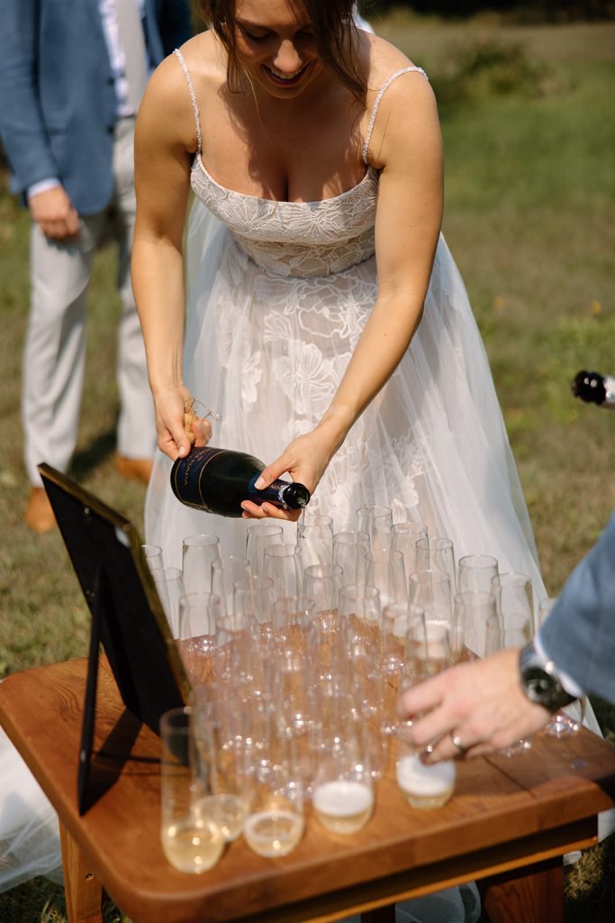 bride pouring champagne
