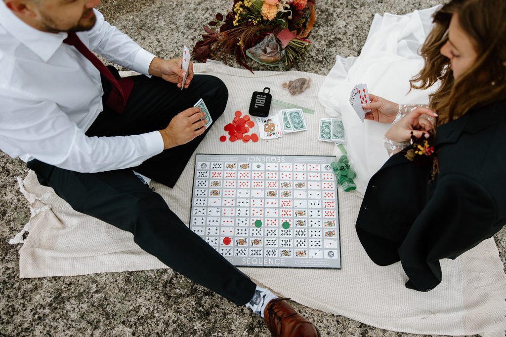 Fun elopement ideas is playing a board game on your elopement day.