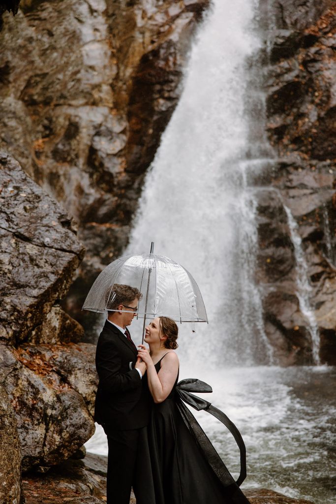 Ultimate Glen Ellis waterfall Fall elopement and wedding guide in the White Mountains of New Hampshire. Black dress and Halloween vibe.