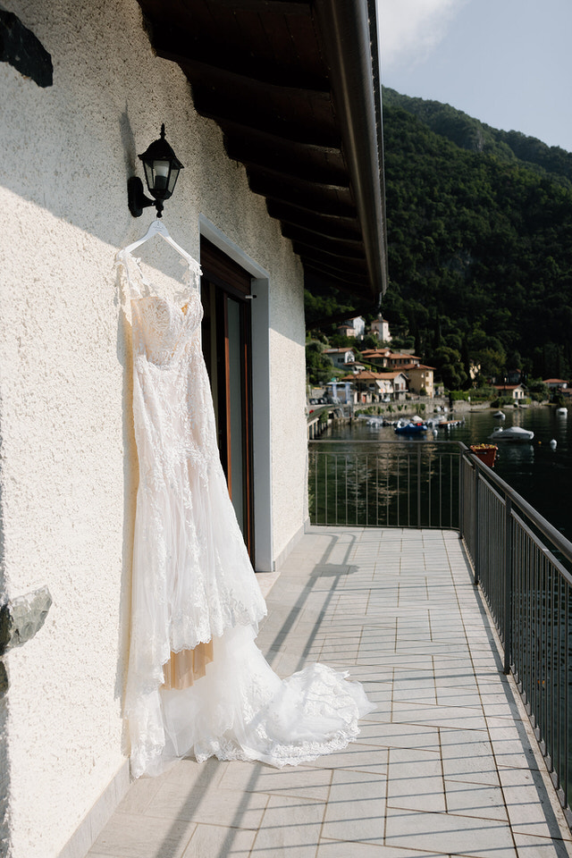 Wedding dress hanging outside villa
