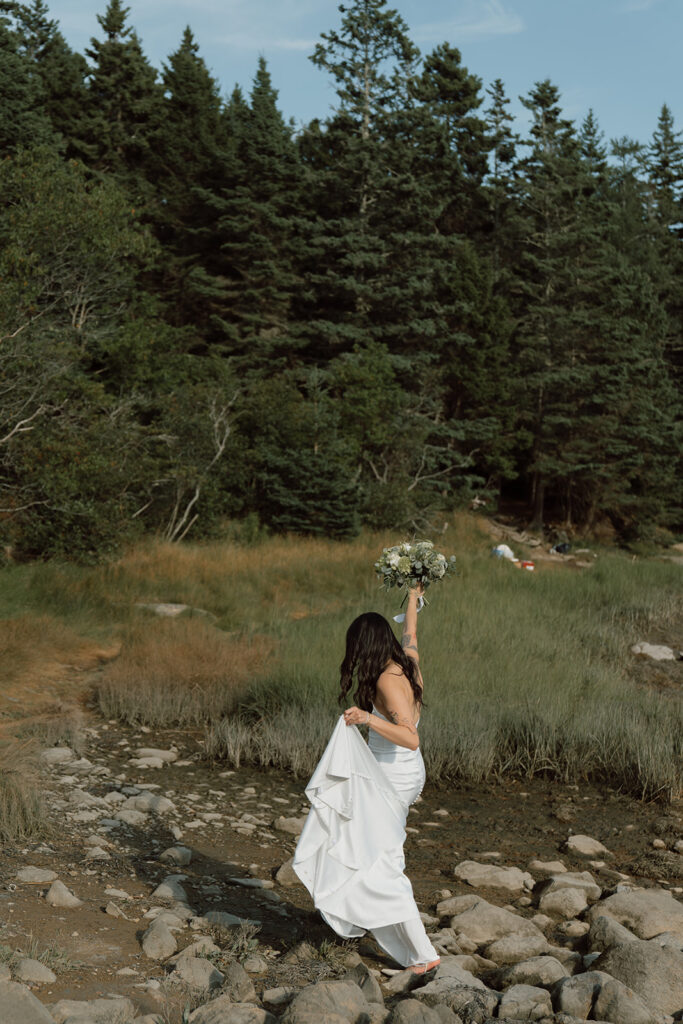 Bride walking on rocks