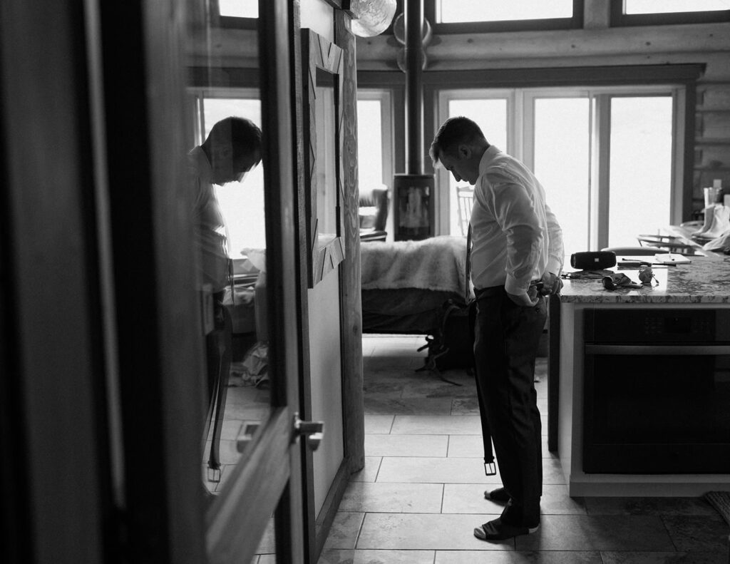 Downtown Telluride elopement in the San Juan Mountains, stopping at city hall and wandering downtown before elopement in the mountains. Groom getting ready at airbnb.