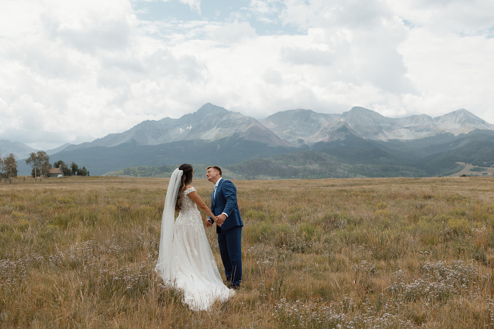 Downtown Telluride elopement in the San Juan Mountains, stopping at city hall and wandering downtown before elopement in the mountains. First look with mountains as backdrop.