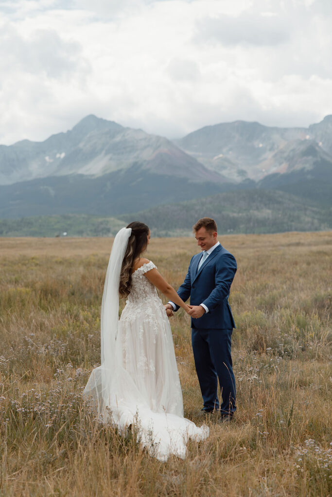 Downtown Telluride elopement in the San Juan Mountains, stopping at city hall and wandering downtown before elopement in the mountains. First look with mountains as backdrop.