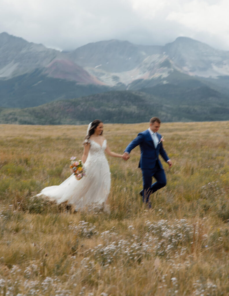 Downtown Telluride elopement in the San Juan Mountains, stopping at city hall and wandering downtown before elopement in the mountains. First look with mountains as backdrop.